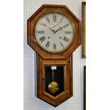 An American Ansonia type wall clock, white dial, Roman numerals, subsidiary seconds.