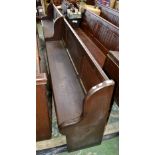 A pitch pine church pew with offset divider 368cm long.