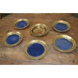Six gilt metal on copper collection plates.