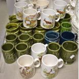 Holkham Hall Pottery - glazed mugs, mostly dark green,