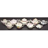 Nine Victorian and Albert Museum 18th century style teapots and covers, Bow, Worcester, Meissen,