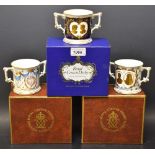 A set of three Royal Crown Derby royal wedding commemorative two handled loving cups,