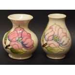 Two Moorcroft magnolia pattern vases of bulbous form, 9.