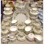 A Royal Doulton Larchmont pattern coffee and tea set; a Colclough tea set printed with blue flowers;