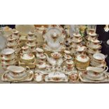 A Royal Albert Old Country Roses dinner service comprising plates, side plates, cups and saucers,