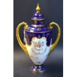 A Coalport two-handled vase and cover, printed with flowers, gilt leafy swag, the neck,