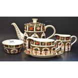 A Royal Crown Derby 1128 pattern Imari teapot, milk jug, sugar bowl,