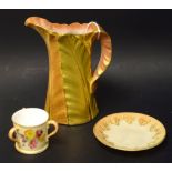 A Royal Worcester miniature three-handled loving cup,