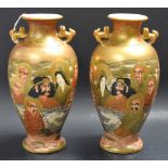 A pair of Japanese Satsuma ovoid vases, decorated in gilt with immortals, lions to handles,