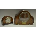 An Art Deco eight-day movement mantel clock, Roman numerals; an oak mantel clock,