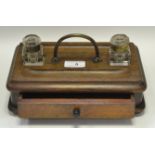 A late Victorian oak two-bottle inkstand, drawer to base, c.