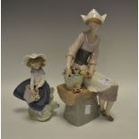 A Lladro figure of a girl with a basket of flowers;