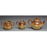 A Doulton Lambeth salt glazed stoneware three piece tea service, sprigged with hunting scenes,