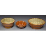 A Brampton brown salt glazed stoneware oval jelly mould, in relief with fish and flutes, 20cm wide,