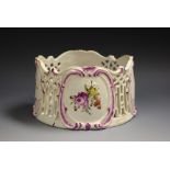 A German Rococo porcelain standish, painted with Deutsche Blumen in colourful polychrome,