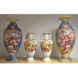 A pair of Japanese Satsuma vases relief decorated with figures and blossoming trees;