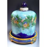 A large circular Majolica cheese dish and cover,