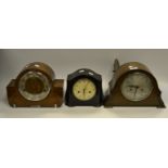 A Smiths bakelite mantel clock; an oak mantel clock silvered dial Arabic numerals;