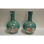 A pair of mid 20th century Chinese ovoid vases on an apple green ground ,