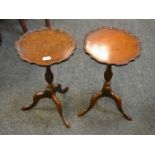 A pair of reproduction mahogany and burr walnut wavey edged circular occasional tables, dished top,