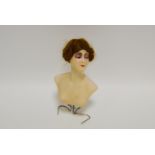 An early 20th century small wax display bust, impressed marks, c.