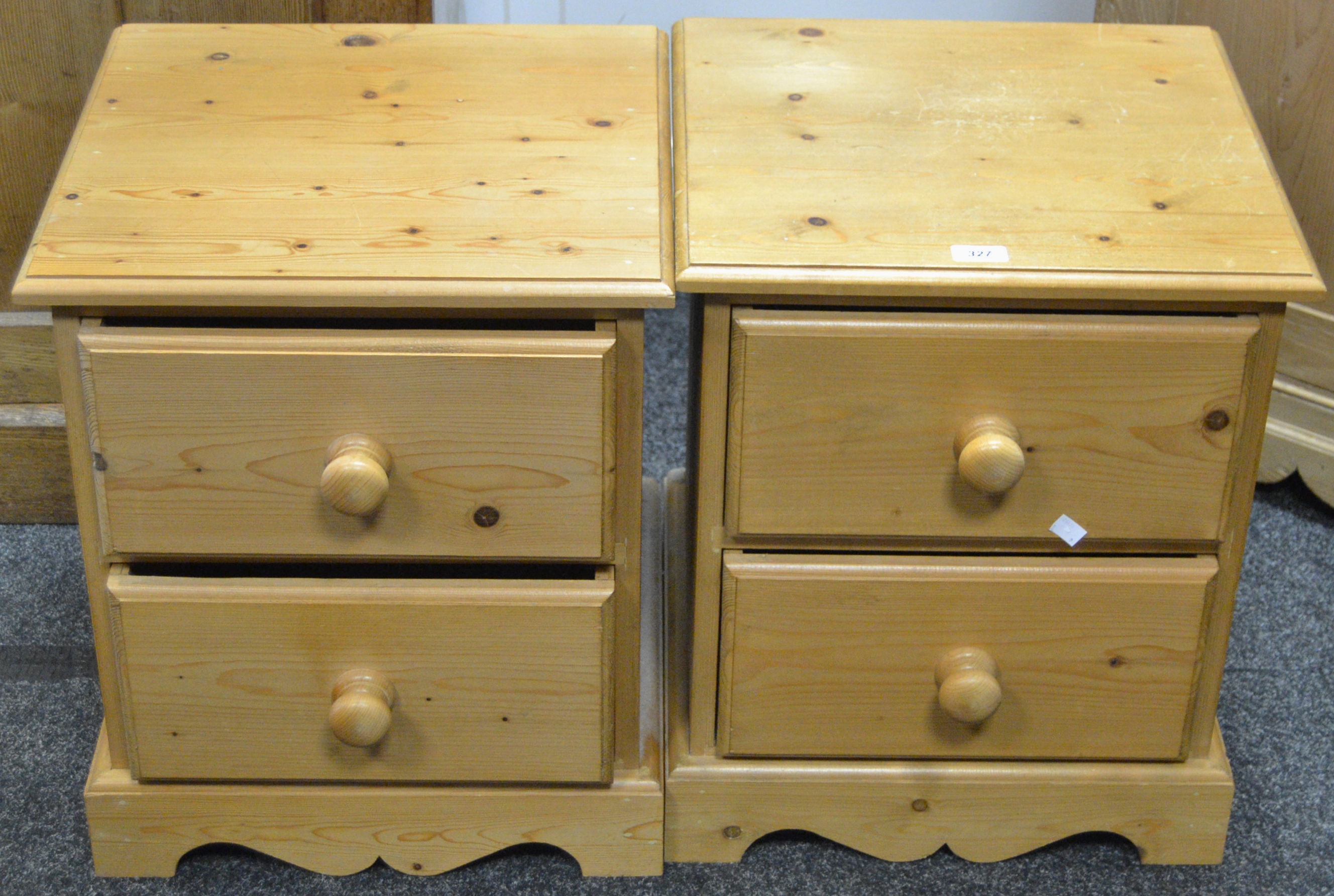 A pair of contemporary pine bedside cabinets, two drawers,