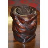 A Chinese rootwood brush pot, of polished natural form, 17cm high,
