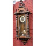 A Victorian mahogany Vienna wall clock, horse rampant to pediment, enamelled chapter ring,