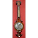 A mid-19th century mahogany wheel barometer onion top, silvered dial and thermometer.