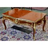 A Louis XVI style kingwood gilt mounted coffee table, parquetry inlaid crossbanded serpentine top,