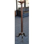 A George III Revival mahogany torchere, dished circular top, fluted column, cabriole legs,