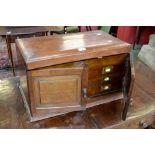 A large Edwardian mahogany canteen case, with hinged top above two cabinet doors,