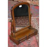 A Victorian mahogany toilette mirror, arch-top mirror, two small drawers to base, c.