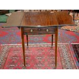 A Regency mahogany bat wing Pembroke table, single drawer to frieze, brass drum handles,