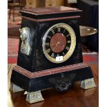 An Egyptian Revival rouge and belge noir mantel clock, the 18cm dial with black chapter ring,