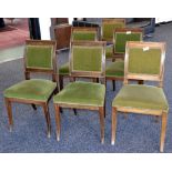 A set of six Empire style mahogany dining chairs, brass mounted swept rectangular backs,