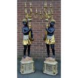 A contemporary pair of Blackamoor six branch candelabra floor lamps. 192cm high.