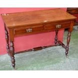 A Victorian walnut and mahogany two drawer side table, circa 1860.