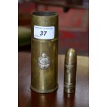 A World War Two Trench Art shell lighter;