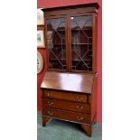 A George III Revival mahogany bureau bookcase,