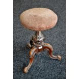 A Victorian mahogany adjustable piano stool, circular seat, acanthus carved column,