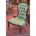 A Victorian style button upholstered spoonback nursing chair.