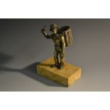 A 19th century bronze novelty pen stand, as a street vendor, he stands, a basket on his back,