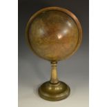 A 19th century brass desk 'gimbal' globe, set on a baring within an horizon band, domed base, 39.