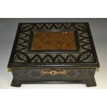 A 19th century Continental ebonised table box, hinged cover with inset etched copper panel,