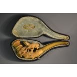 A 19th century Meerschaum pipe, carved with a ram on a rocky outcrop, 15cm long, cased, c.