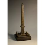 A 19th century Grand Tour bronze desk model, of an obelisk, square black marble base, 17.