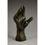 A 19th century dark patinated cast iron novelty desk weight, as a hand,