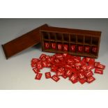 A 19th century French stained bone child's spelling alphabet, mahogany box with sliding cover, 22.
