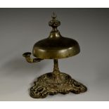 A 19th century patinated bronze counter bell, knopped finial, sprung mechanism,